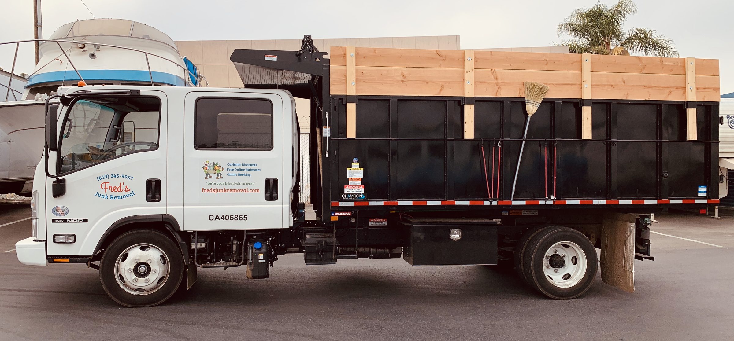 Fred's dump truck with a black cargo bed, used to price a load by dump-bed tier